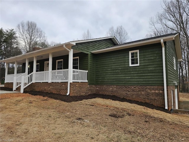 ranch-style home with covered porch