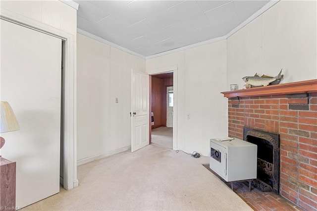 carpeted living room featuring crown molding and a fireplace