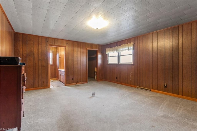 unfurnished bedroom with light carpet and ensuite bath