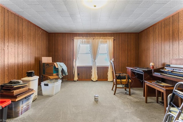 office area with carpet and wooden walls