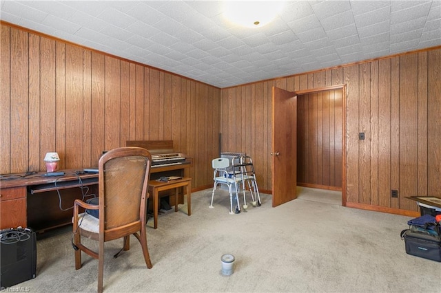 office with light carpet and wooden walls