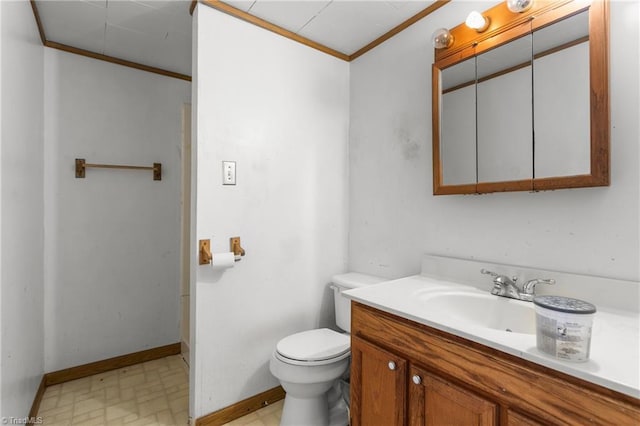 bathroom featuring vanity, toilet, and crown molding