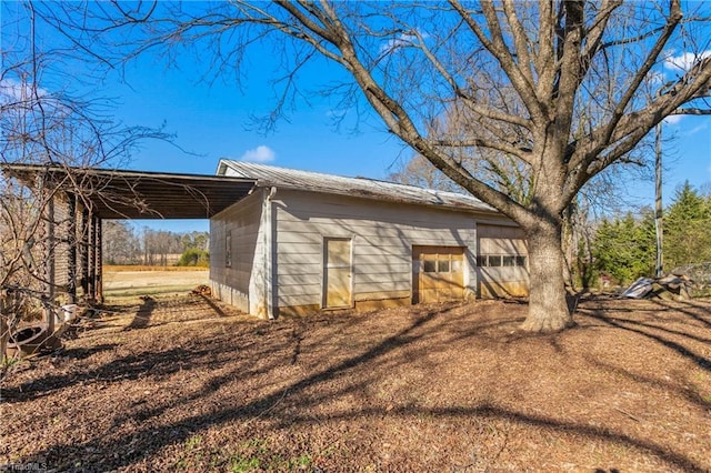 view of home's exterior with a carport