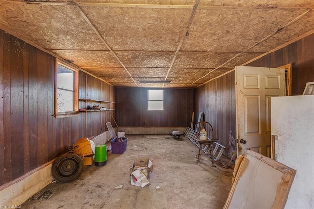 miscellaneous room featuring wooden walls