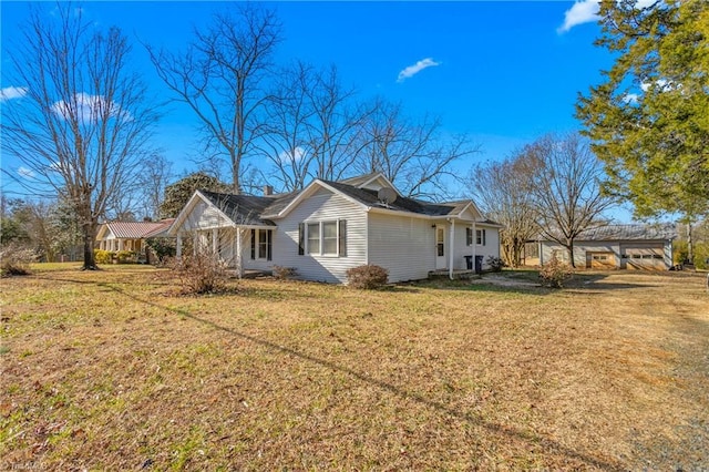 view of side of home featuring a lawn