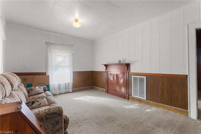 sitting room featuring light colored carpet