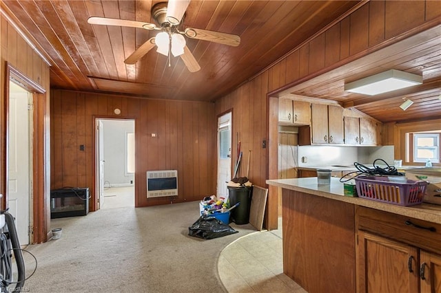 kitchen featuring heating unit, ceiling fan, light colored carpet, and wooden ceiling