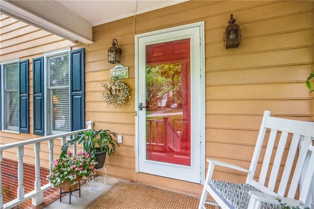 entrance to property featuring a porch