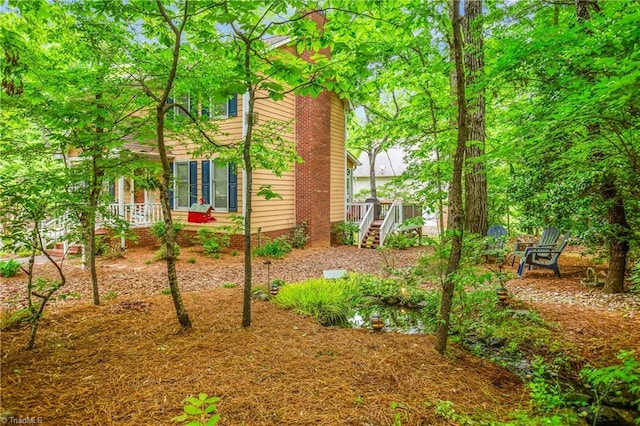 view of yard featuring stairs