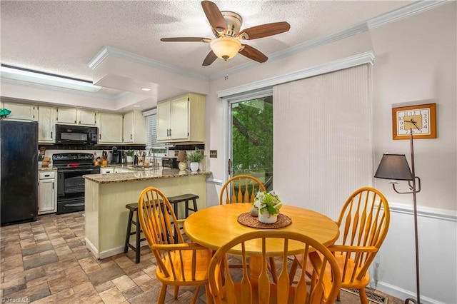 dining space featuring visible vents, ornamental molding, a textured ceiling, a ceiling fan, and stone finish flooring