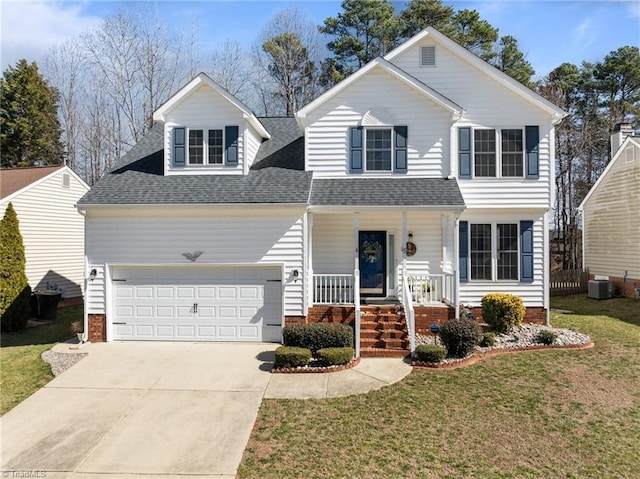 view of front of house with a porch, an attached garage, cooling unit, driveway, and a front yard