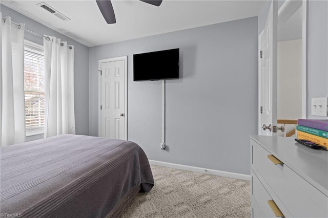 bedroom with baseboards, visible vents, ceiling fan, and carpet flooring