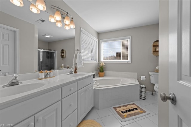 bathroom featuring a stall shower, a sink, visible vents, and tile patterned floors