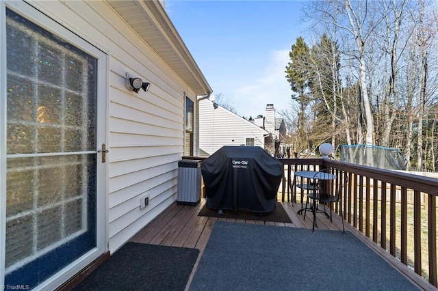 wooden terrace featuring grilling area