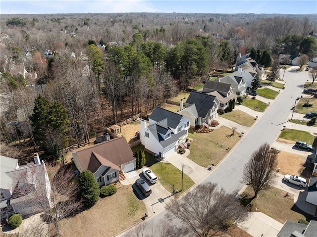 aerial view featuring a residential view and a view of trees