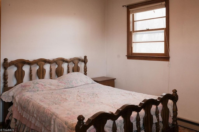 bedroom featuring a baseboard heating unit