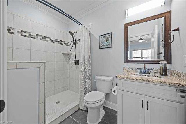 bathroom featuring tile patterned flooring, crown molding, toilet, a tile shower, and vanity