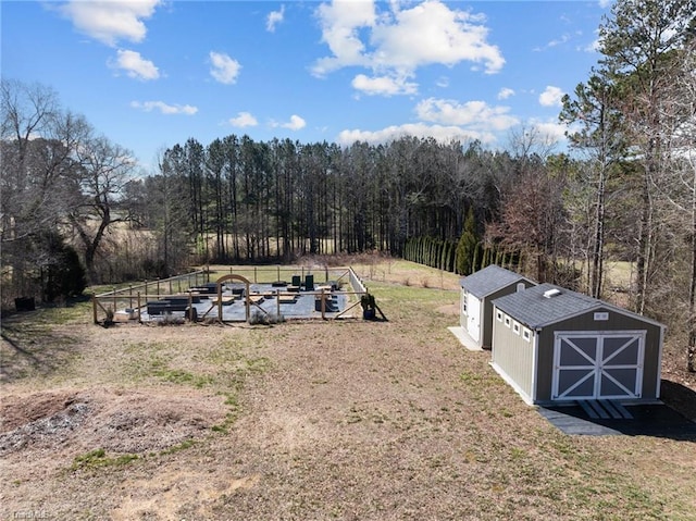 birds eye view of property featuring a view of trees