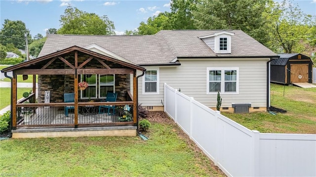 525 Carolina Blvd, Salisbury, NC 28146 - back of property featuring crawl space, a storage unit, and a fenced backyard