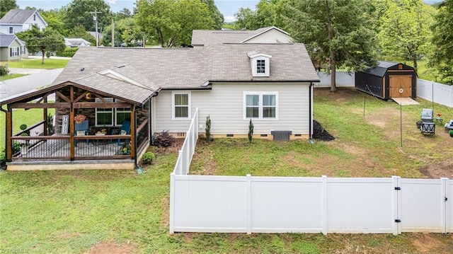 525 Carolina Blvd, Salisbury, NC 28146 - rear view of property featuring crawl space, a fenced backyard, a shed, and a shingled roof