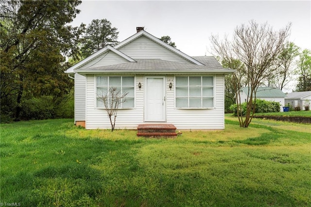 bungalow with a front lawn
