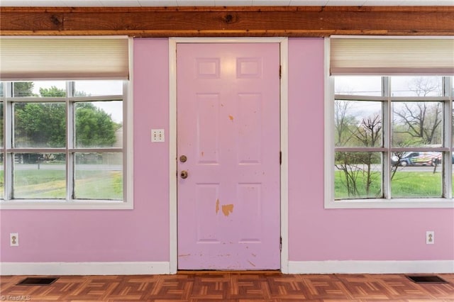 entrance foyer featuring baseboards and visible vents