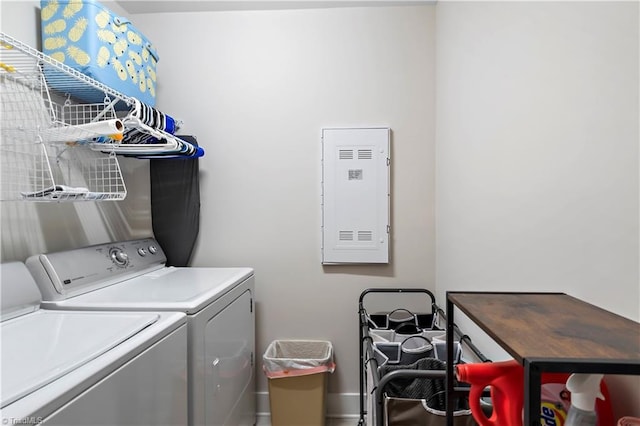 clothes washing area with independent washer and dryer