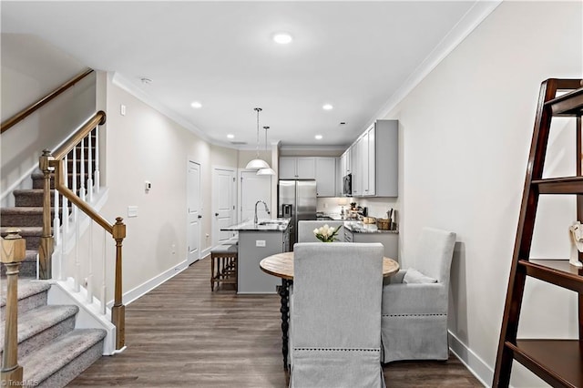 dining room featuring ornamental molding, stairway, baseboards, dark wood-type flooring, and recessed lighting