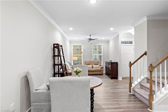 dining room with ornamental molding, recessed lighting, light wood-style flooring, ceiling fan, and stairway