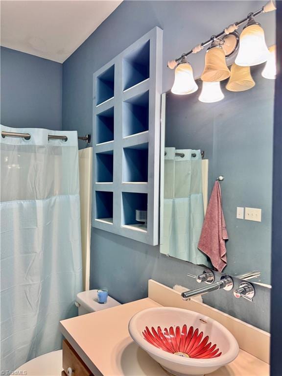 220 Market St Unit 110, Greensboro, NC 27401 - bathroom featuring vanity, a shower with curtain, and toilet