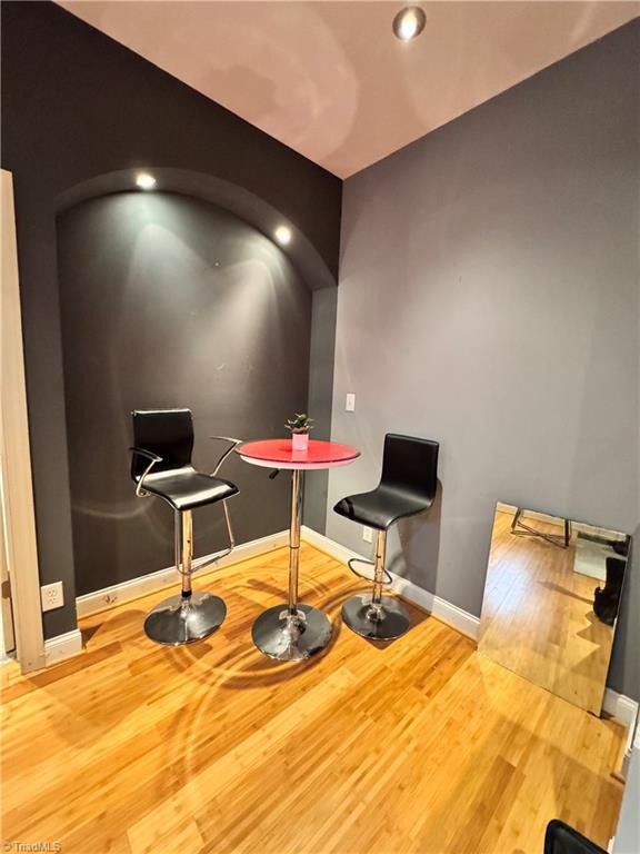 220 Market St Unit 110, Greensboro, NC 27401 - recreation room with wood finished floors, baseboards, and recessed lighting
