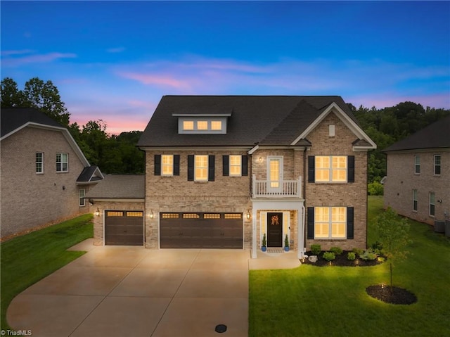 6224 Kershaw Meadows Rd, Pfafftown, NC 27040 - colonial-style house with driveway, a front yard, brick siding, and an attached garage