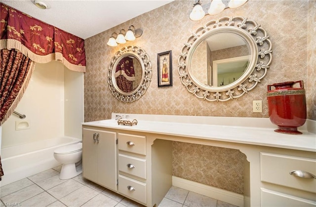 full bathroom featuring bathtub / shower combination, toilet, a textured ceiling, large vanity, and tile floors