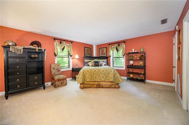 bedroom with light colored carpet