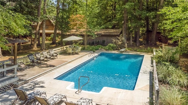 view of swimming pool featuring a patio area