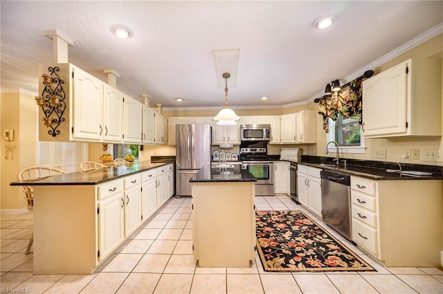 kitchen featuring a kitchen island, stainless steel appliances, light tile flooring, and dark stone countertops