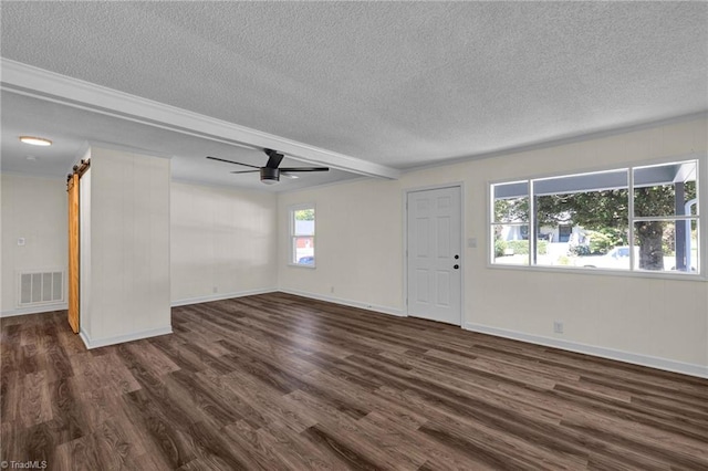 interior space featuring a textured ceiling, plenty of natural light, and dark hardwood / wood-style flooring