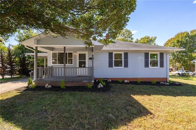 view of front of property with a front yard and covered porch