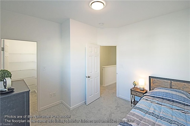 bedroom featuring carpet floors and baseboards