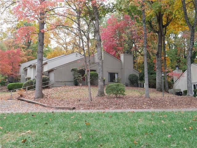 view of property exterior featuring a chimney