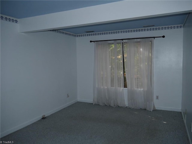 unfurnished room featuring carpet floors