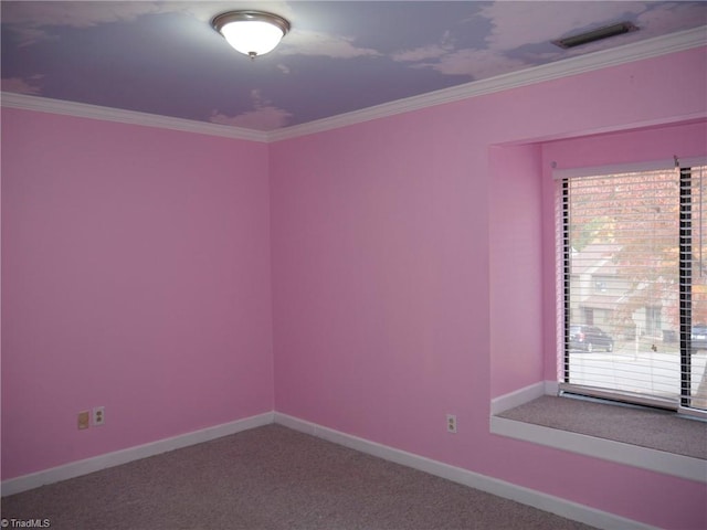 carpeted empty room featuring crown molding