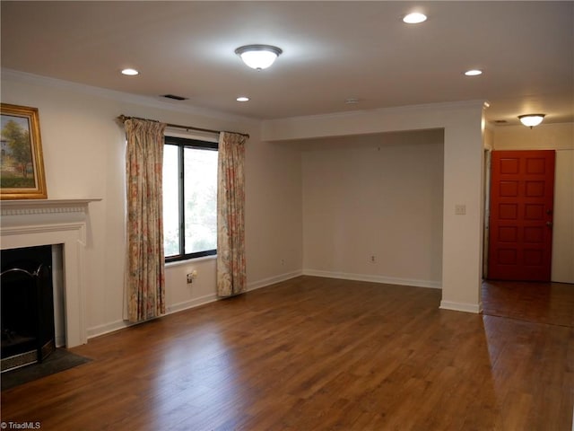 unfurnished living room featuring crown molding and dark hardwood / wood-style floors