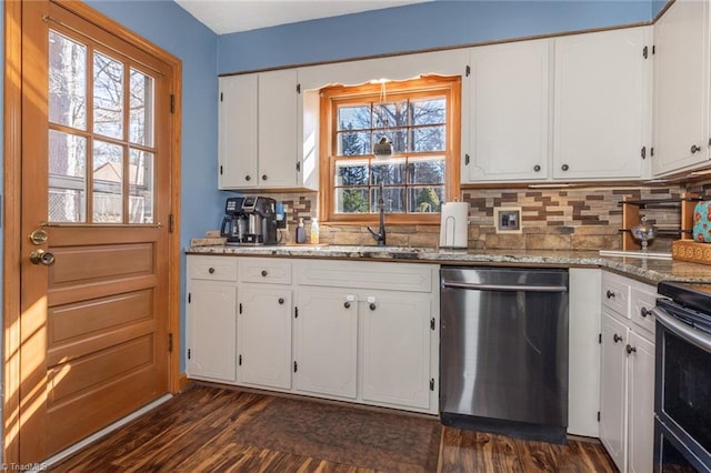 kitchen featuring dark wood finished floors, stainless steel appliances, white cabinets, stone counters, and decorative backsplash