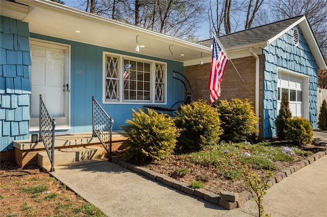 property entrance with an attached garage