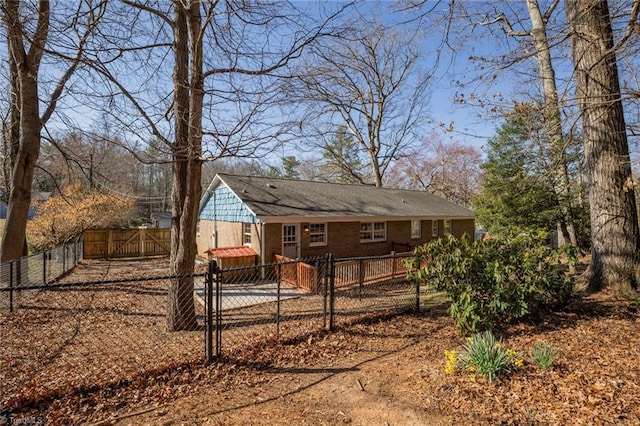 back of house featuring a fenced backyard