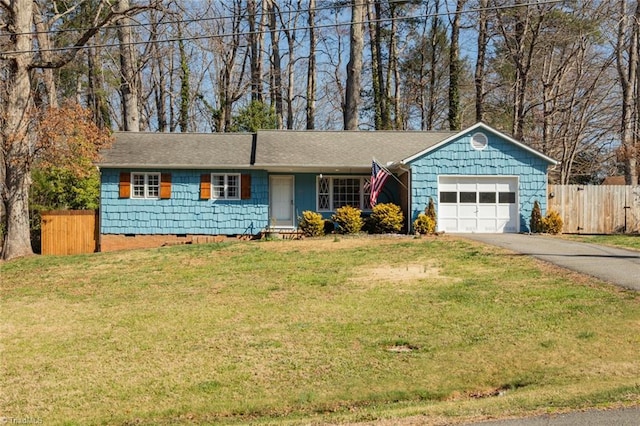 single story home with fence, aphalt driveway, a front yard, crawl space, and an attached garage