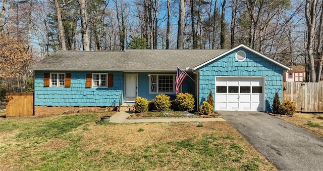 ranch-style house featuring fence, a front lawn, a garage, crawl space, and aphalt driveway