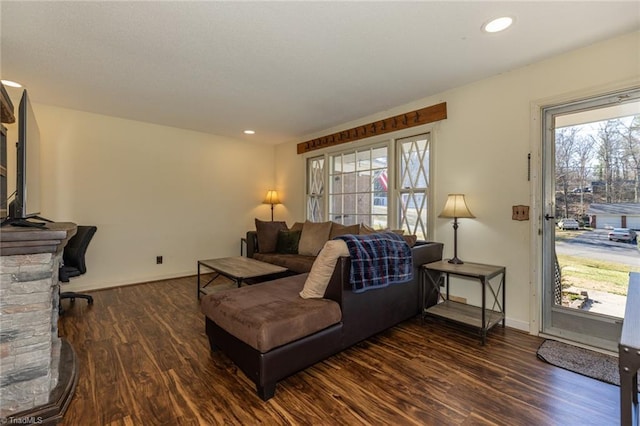 living area with recessed lighting, baseboards, and dark wood-style floors