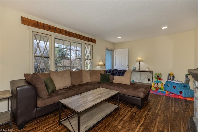 living area featuring recessed lighting, wood finished floors, and a textured ceiling